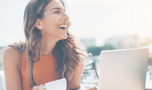 Business woman working remotely and smiling